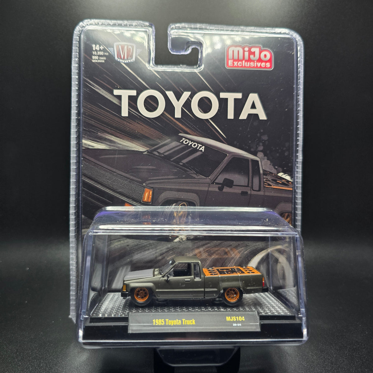 M2 Machines 1:64 1985 Toyota Pickup Truck Slammed Custom – Matte Grey w/ Carbon Hood
